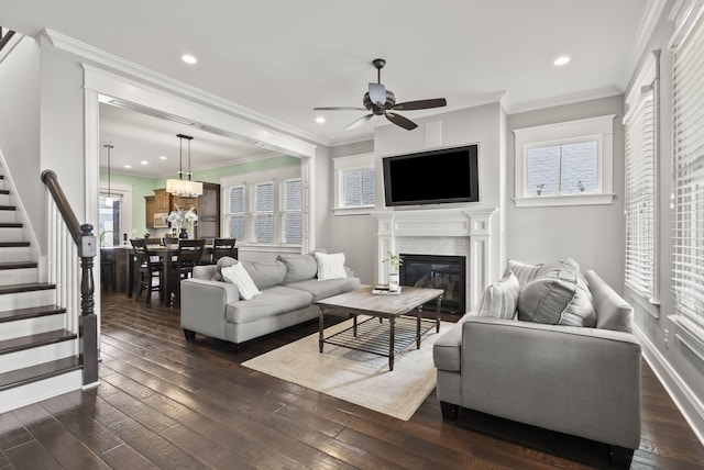 10910 Kings Crown Dr, Prospect, KY 40059 - living area with ceiling fan, a glass covered fireplace, stairway, dark wood-style flooring, and recessed lighting