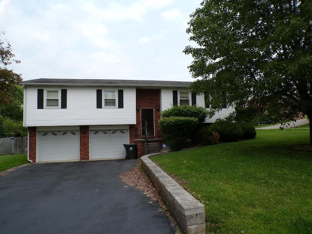 706 Allf Ln, London, KY 40741 - split foyer home with brick siding, asphalt driveway, and a front yard