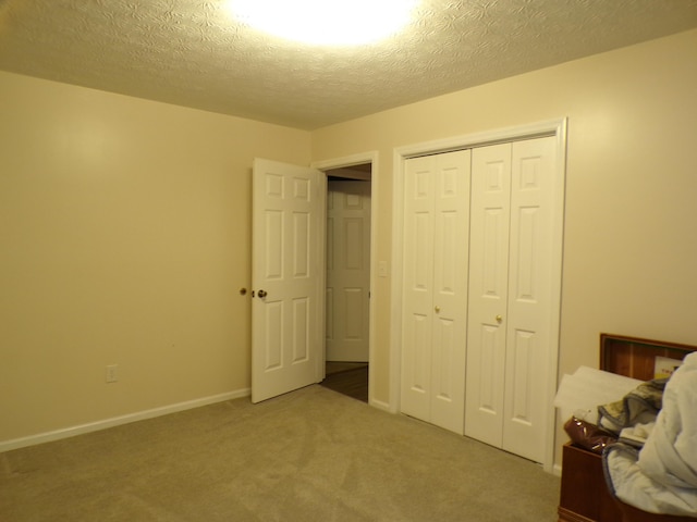 706 Allf Ln, London, KY 40741 - bedroom featuring carpet floors, a closet, a textured ceiling, and baseboards