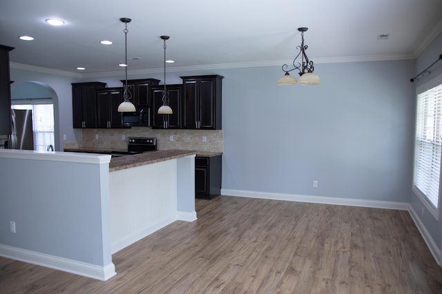 4745 Willman Way, Lexington, KY 40509 - kitchen featuring black microwave, refrigerator, range with electric stovetop, arched walkways, and light wood-style floors