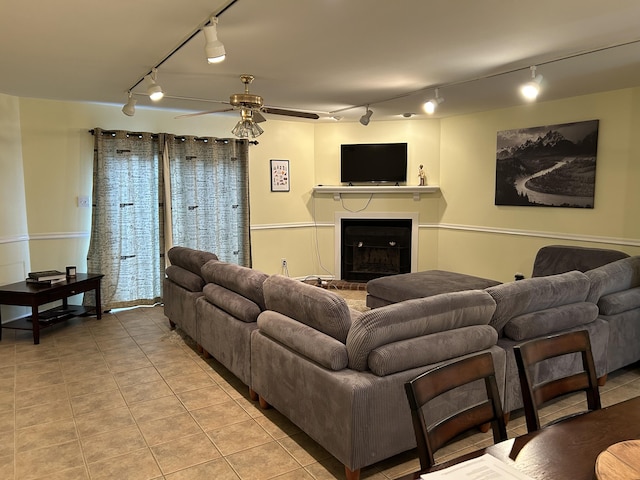 1125 Turkey Foot Rd Unit 3, Lexington, KY 40502 - living area featuring rail lighting, ceiling fan, light tile patterned floors, and a fireplace with raised hearth