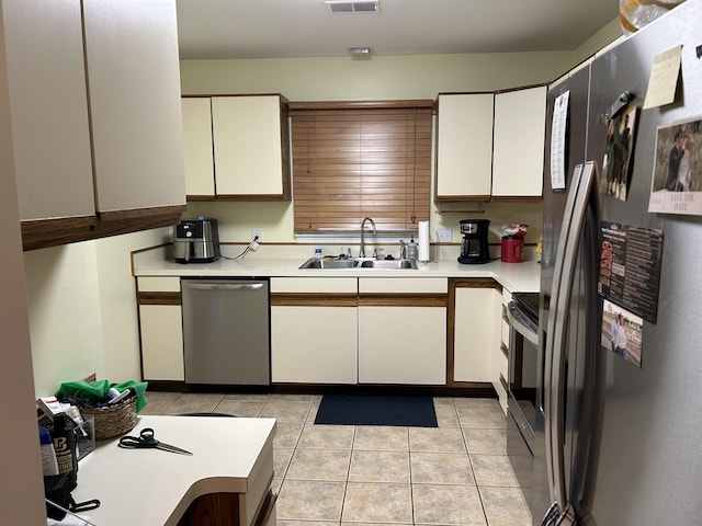 1125 Turkey Foot Rd Unit 3, Lexington, KY 40502 - kitchen featuring appliances with stainless steel finishes, a sink, light countertops, and white cabinets