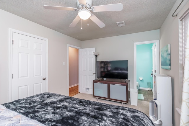 2812 Winter Park Dr, Lexington, KY 40517 - bedroom featuring light carpet, a textured ceiling, ceiling fan, baseboards, and ensuite bath