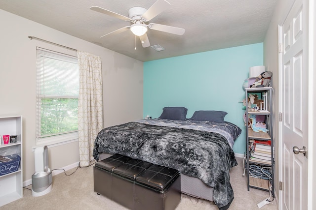 2812 Winter Park Dr, Lexington, KY 40517 - bedroom with multiple windows, light colored carpet, baseboards, a ceiling fan, and a textured ceiling