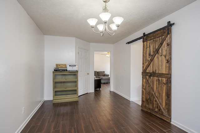 753 Woodhaven Pl, Lexington, KY 40514 - unfurnished room featuring wood finished floors, a chandelier, a barn door, baseboards, and a textured ceiling
