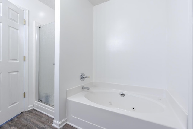 753 Woodhaven Pl, Lexington, KY 40514 - full bath featuring a stall shower, a jetted tub, and wood finished floors
