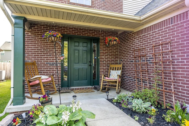 753 Woodhaven Pl, Lexington, KY 40514 - view of exterior entry featuring brick siding, central air condition unit, and covered porch