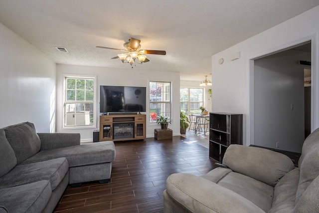 753 Woodhaven Pl, Lexington, KY 40514 - living area featuring a ceiling fan, wood tiled floors, a chandelier, and baseboards
