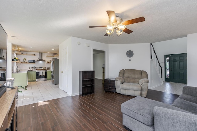 753 Woodhaven Pl, Lexington, KY 40514 - living room with ceiling fan, stairway, light wood-style floors, a textured ceiling, and baseboards