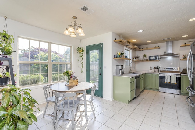 753 Woodhaven Pl, Lexington, KY 40514 - kitchen with green cabinetry, appliances with stainless steel finishes, range hood, open shelves, and a sink