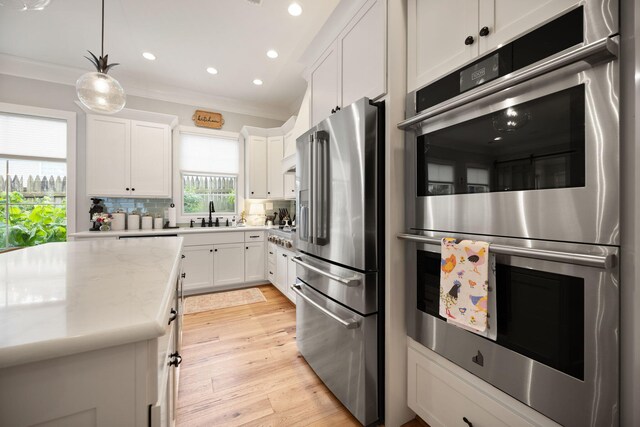 4291 Captains Ct, Lexington, KY 40513 - kitchen with appliances with stainless steel finishes, recessed lighting, tasteful backsplash, white cabinetry, and a sink