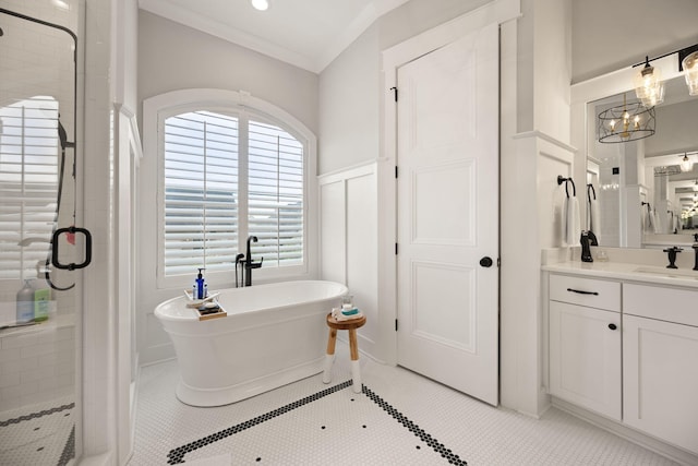 4291 Captains Ct, Lexington, KY 40513 - full bath with a stall shower, vanity, a freestanding bath, wainscoting, and a chandelier