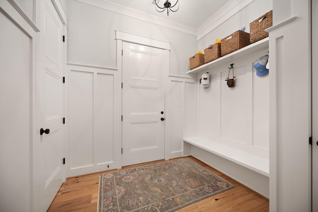 4291 Captains Ct, Lexington, KY 40513 - mudroom featuring a decorative wall, light wood-style floors, ornamental molding, and a wainscoted wall