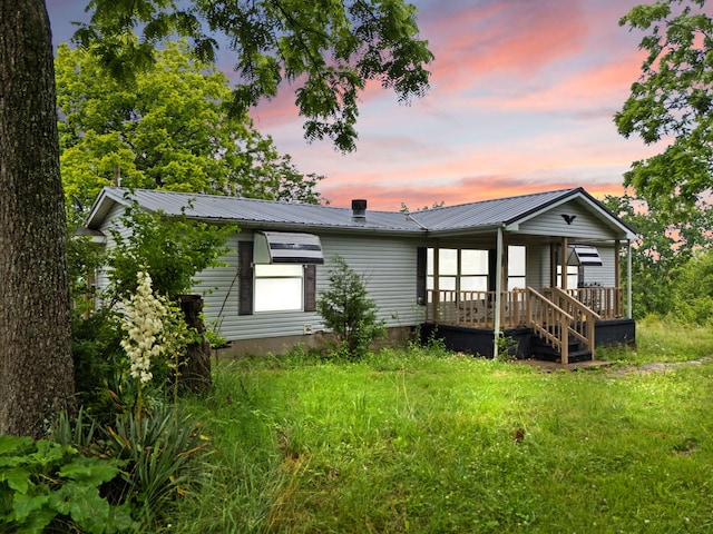 2125 High Reeves Spur 1, Richmond, KY 40475 - back of house at dusk featuring covered porch and a metal roof