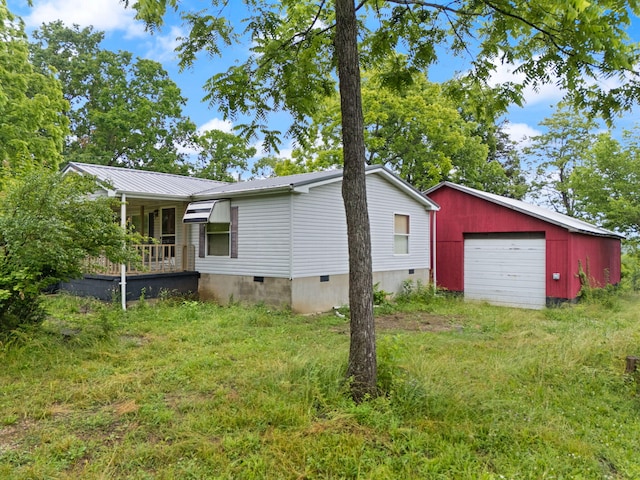 2125 High Reeves Spur 1, Richmond, KY 40475 - view of side of property featuring crawl space, a detached garage, an outbuilding, and a metal roof