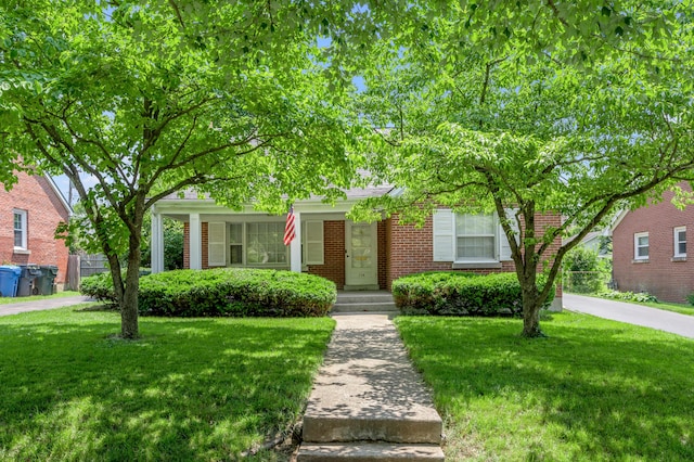 256 Glendale Ave, Lexington, KY 40511 - obstructed view of property with a front lawn and brick siding