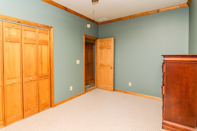 3900 Upper Sharpsburg, Carlisle, KY 40311 - unfurnished bedroom with ornamental molding, baseboards, carpet flooring, a ceiling fan, and a closet