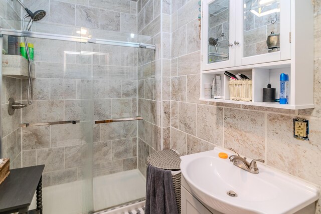 3900 Upper Sharpsburg, Carlisle, KY 40311 - full bathroom featuring vanity, a shower stall, and tile walls