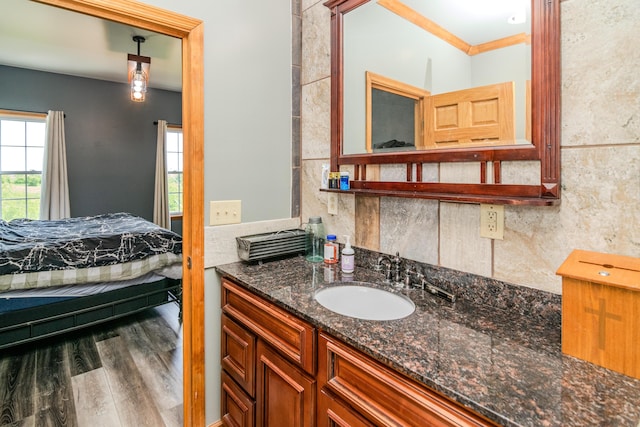 3900 Upper Sharpsburg, Carlisle, KY 40311 - bathroom featuring vanity, backsplash, wood finished floors, ornamental molding, and ensuite bathroom