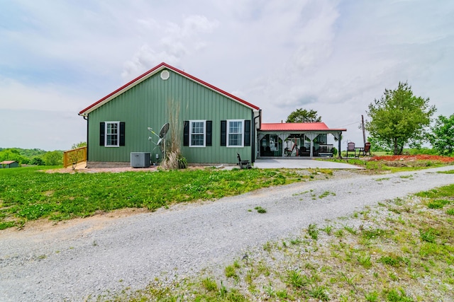 3900 Upper Sharpsburg, Carlisle, KY 40311 - view of home's exterior featuring central air condition unit and gravel driveway