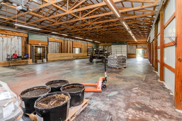 3900 Upper Sharpsburg, Carlisle, KY 40311 - miscellaneous room featuring a garage, concrete floors, and high vaulted ceiling