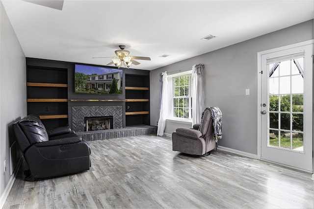 113 Bramble Ct, Nicholasville, KY 40356 - living area with wood finished floors, ceiling fan, a fireplace, and baseboards