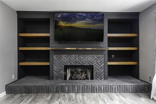 113 Bramble Ct, Nicholasville, KY 40356 - detailed view of wood finished floors, baseboards, and a fireplace