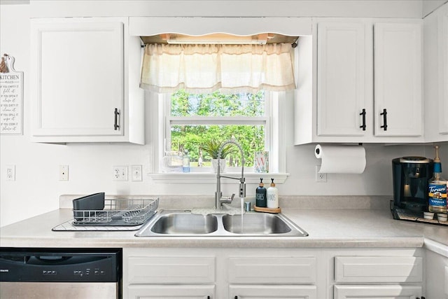 1008 Ramsey Branch Rd, Artemus, KY 40903 - kitchen with stainless steel dishwasher, a sink, and white cabinetry