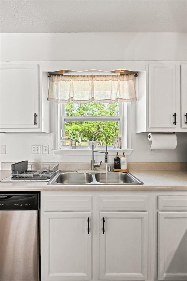 1008 Ramsey Branch Rd, Artemus, KY 40903 - kitchen featuring stainless steel dishwasher, a sink, and white cabinets