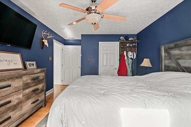 1008 Ramsey Branch Rd, Artemus, KY 40903 - bedroom featuring wood finished floors, ceiling fan, and baseboards