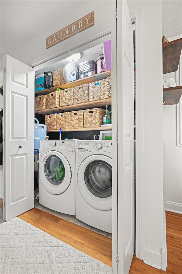 1008 Ramsey Branch Rd, Artemus, KY 40903 - washroom with wood finished floors and washing machine and dryer