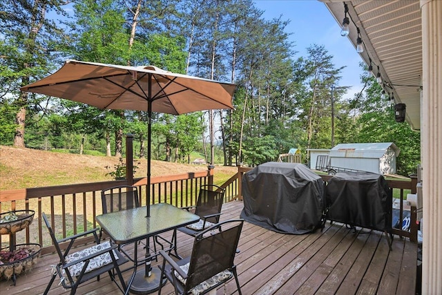 1008 Ramsey Branch Rd, Artemus, KY 40903 - deck with outdoor dining space, area for grilling, and view of wooded area