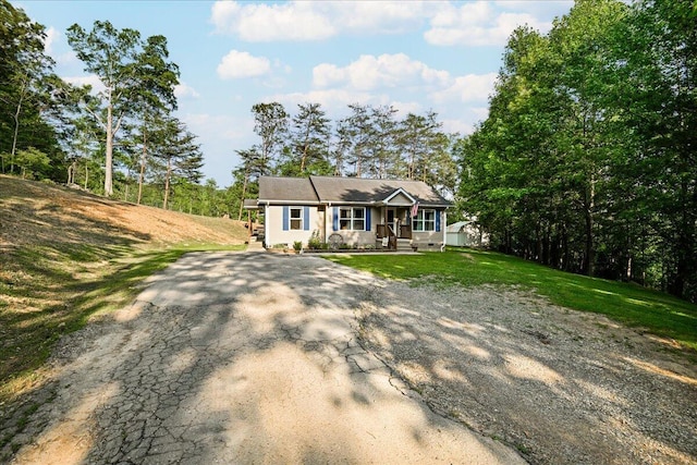 1008 Ramsey Branch Rd, Artemus, KY 40903 - ranch-style house with a porch, asphalt driveway, and a front yard