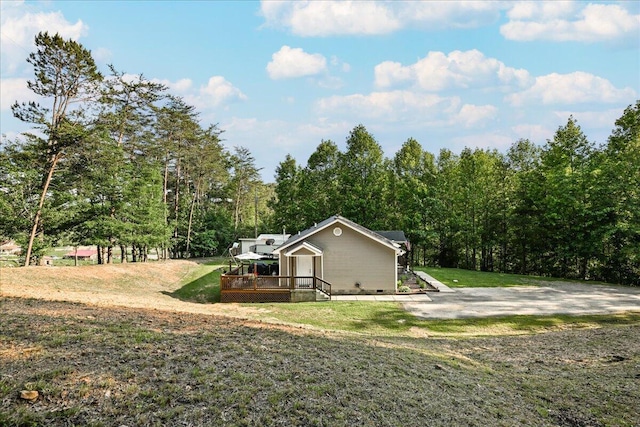 1008 Ramsey Branch Rd, Artemus, KY 40903 - view of side of home with a wooden deck and a yard