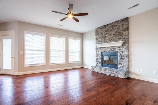 1805 Rachels Run, Lexington, KY 40509 - unfurnished living room with a ceiling fan, a stone fireplace, dark wood finished floors, and healthy amount of natural light