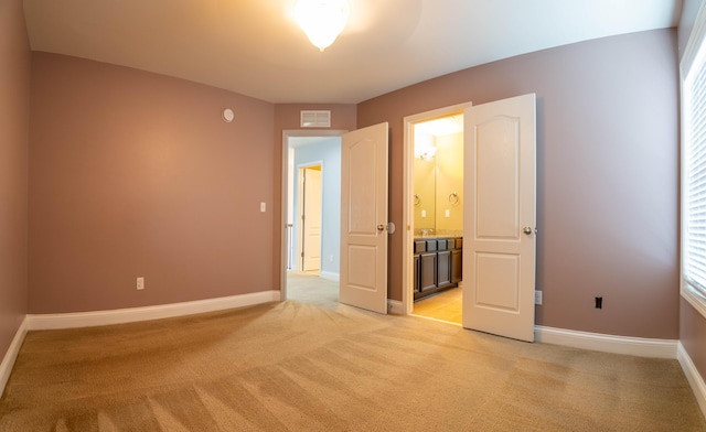 1805 Rachels Run, Lexington, KY 40509 - unfurnished bedroom with light colored carpet, baseboards, and connected bathroom