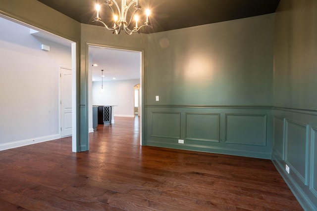1805 Rachels Run, Lexington, KY 40509 - unfurnished dining area featuring a chandelier, a decorative wall, dark wood-style floors, and wainscoting
