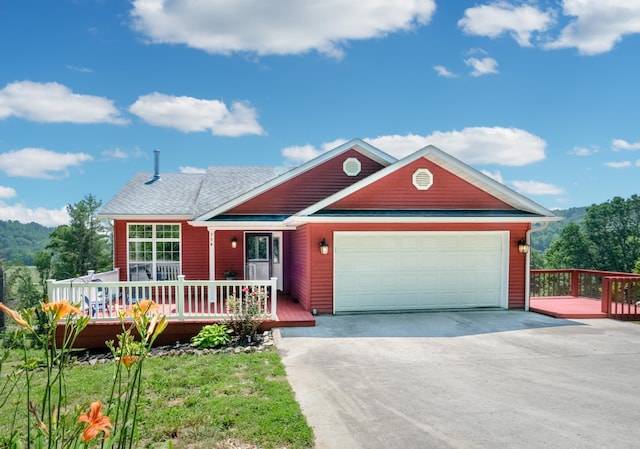 754 Countryside Cir, Mount Vernon, KY 40456 - single story home featuring a garage, driveway, and a wooden deck
