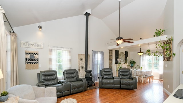 754 Countryside Cir, Mount Vernon, KY 40456 - living room featuring wood finished floors, a ceiling fan, a wood stove, and high vaulted ceiling
