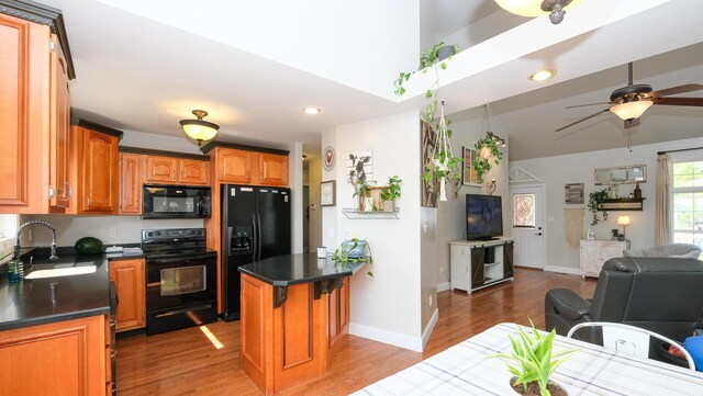 754 Countryside Cir, Mount Vernon, KY 40456 - kitchen featuring black appliances, a sink, open floor plan, dark countertops, and recessed lighting