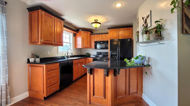 754 Countryside Cir, Mount Vernon, KY 40456 - kitchen featuring black appliances, a sink, dark countertops, wood finished floors, and recessed lighting