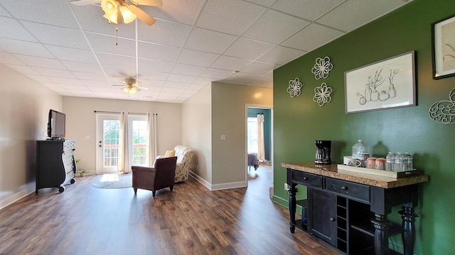754 Countryside Cir, Mount Vernon, KY 40456 - living area with ceiling fan, dark wood-style floors, baseboards, and a paneled ceiling