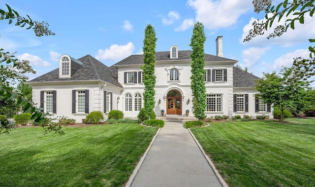 1617 Harmony Hall Ln, Lexington, KY 40502 - view of front of property with french doors, a chimney, and a front lawn