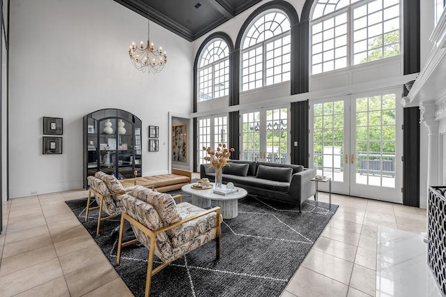 1617 Harmony Hall Ln, Lexington, KY 40502 - living room with a high ceiling, crown molding, french doors, light tile patterned flooring, and a chandelier