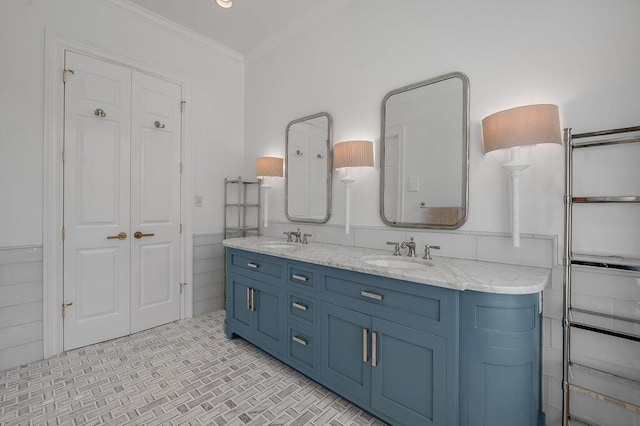 1617 Harmony Hall Ln, Lexington, KY 40502 - full bath with double vanity, ornamental molding, wainscoting, a closet, and brick patterned flooring