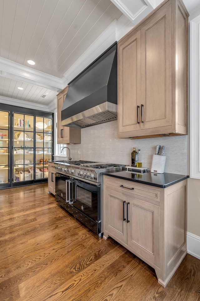 1617 Harmony Hall Ln, Lexington, KY 40502 - kitchen featuring double oven range, wall chimney range hood, dark countertops, dark wood finished floors, and ornamental molding