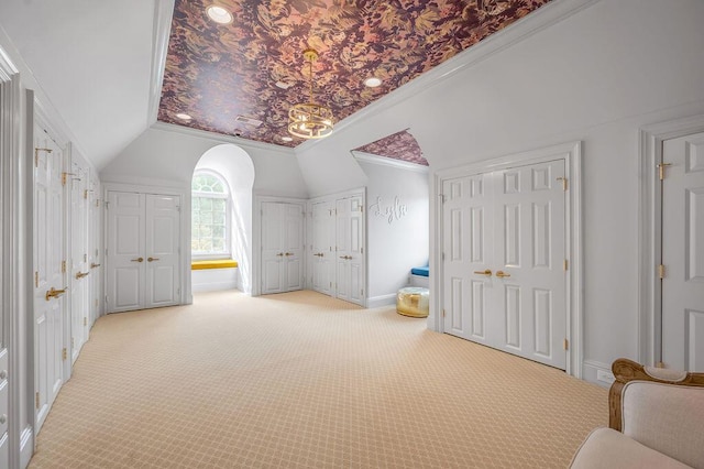 1617 Harmony Hall Ln, Lexington, KY 40502 - additional living space with vaulted ceiling, light carpet, baseboards, and arched walkways