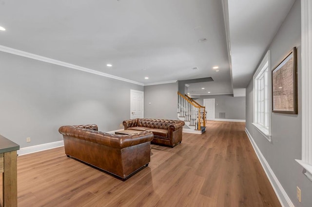 1617 Harmony Hall Ln, Lexington, KY 40502 - living area featuring stairway, wood finished floors, baseboards, crown molding, and recessed lighting