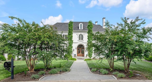 1617 Harmony Hall Ln, Lexington, KY 40502 - french country home featuring french doors, a front yard, and a chimney
