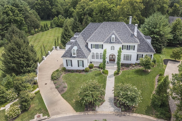 1617 Harmony Hall Ln, Lexington, KY 40502 - view of front of house with a chimney, a front lawn, and a shingled roof